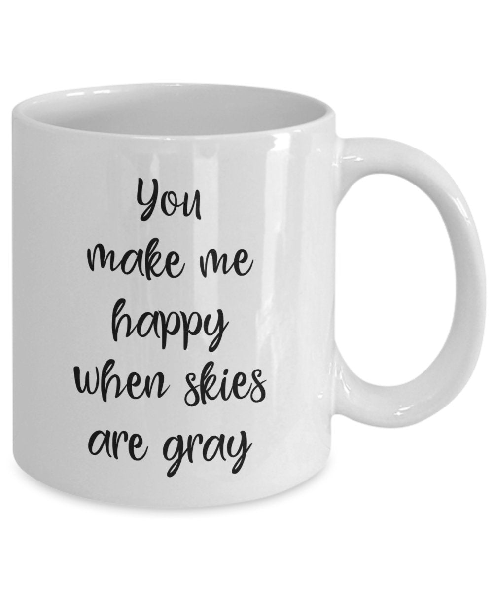 Kaffeebecher mit Aufschrift"You make me happy when skies are gray"