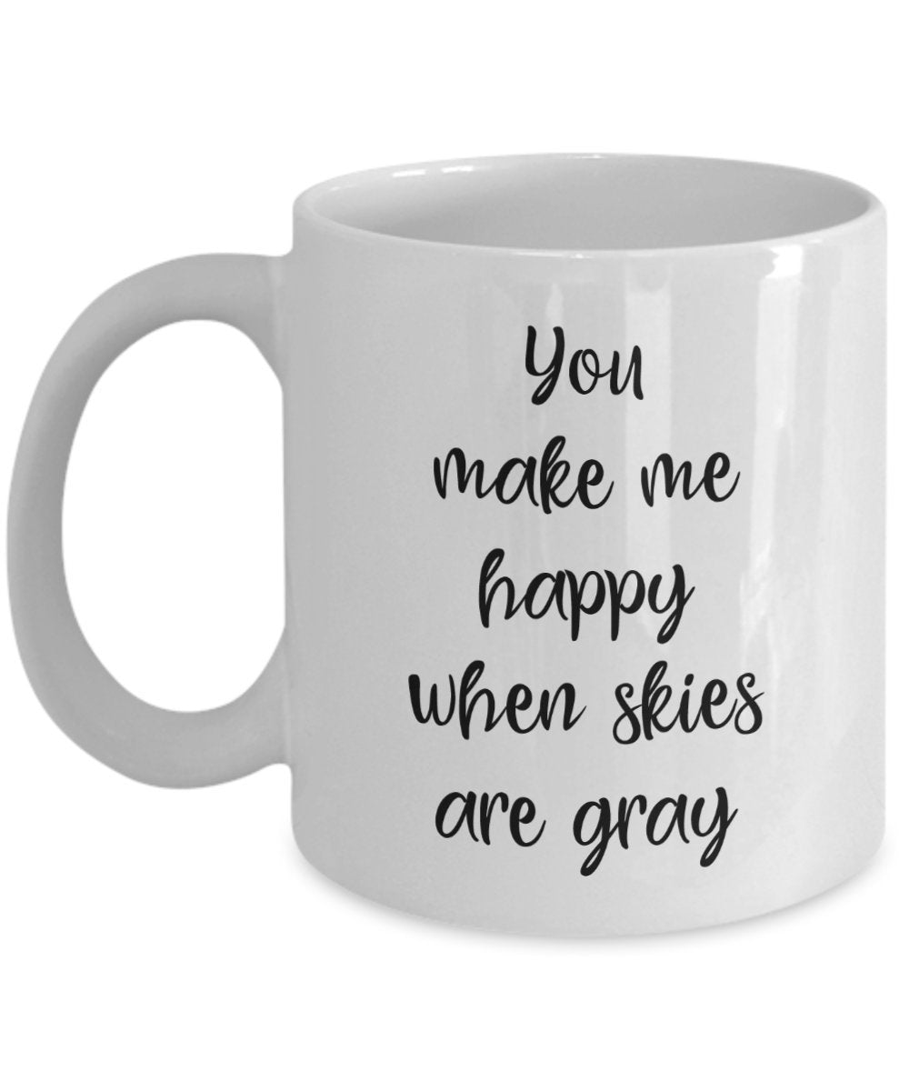 Kaffeebecher mit Aufschrift"You make me happy when skies are gray"